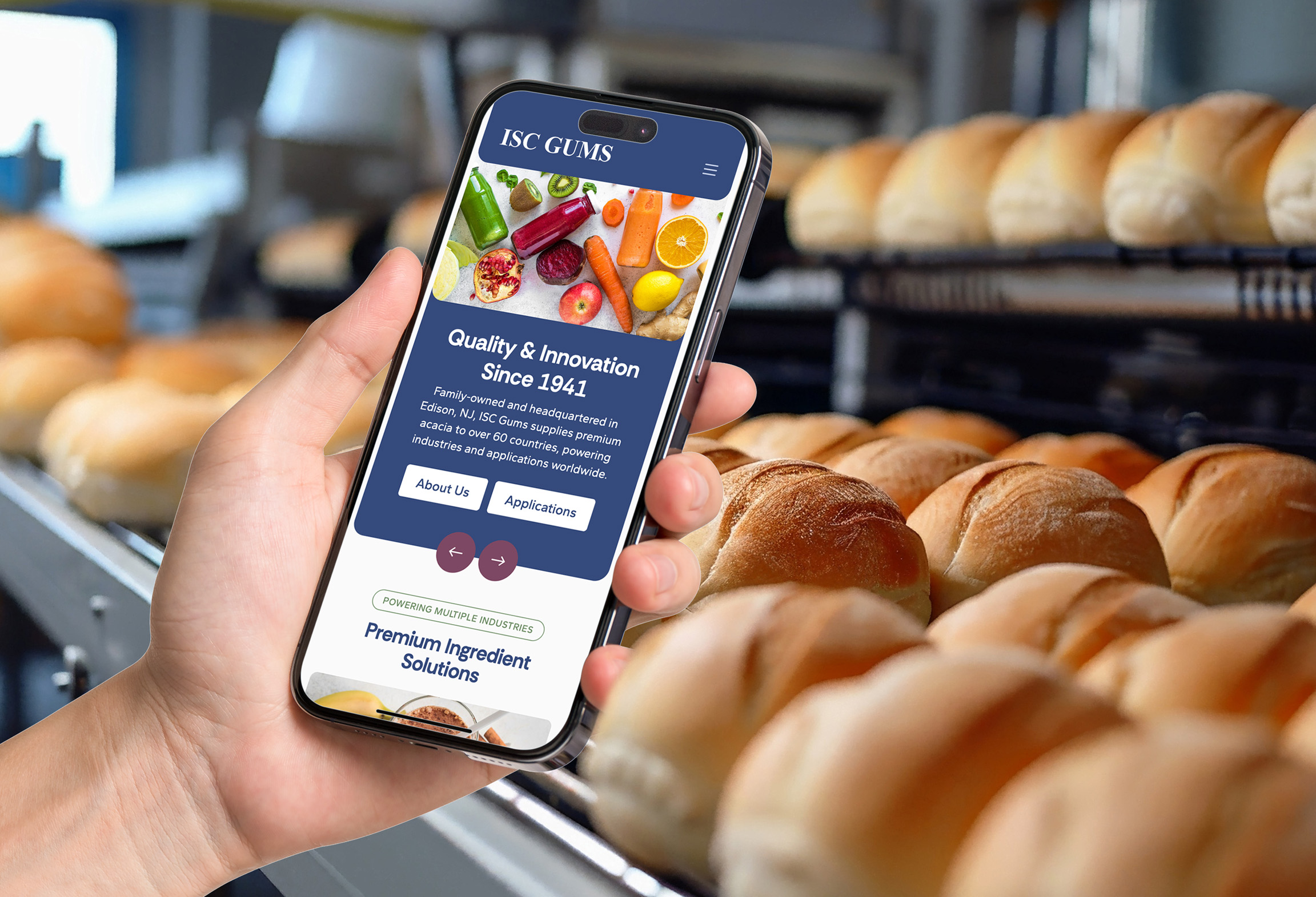 ISC Gums website on a mobile phone surrounded by baked goods